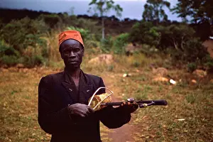 Fiddles: One string fiddle player in Mozambique