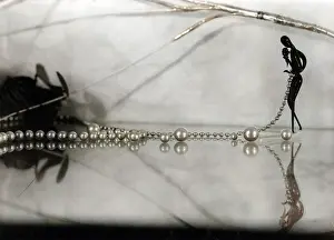 Wearer: STRING OF PEARLS