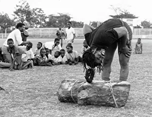 Strongman: Strongman Samson lifting a log with his hair at