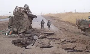 Improvise: Stryker vehicle lies on its side after surviving ?