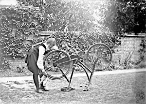 Student cleaning bicycle