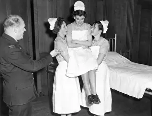 Supervised: Student nurses practising three handed lift