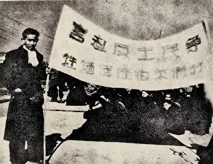 Opposing: Students Held Up a Flag Saying Fighting for Democracy
