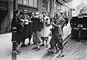 Earn: Students and street musicians, 1932