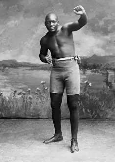 Heavyweights: Studio portrait of boxer Jack Johnson, with