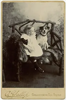 Studio portrait, boy with terrier dog