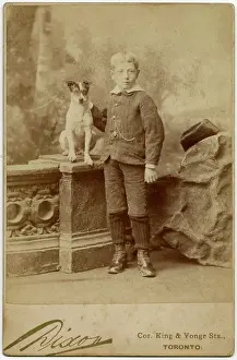 Backdrop: Studio portrait, boy with terrier dog