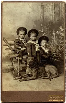 Backdrop: Studio portrait, three boys with dog