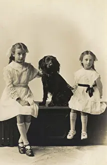 Watford: Studio portrait, two girls with spaniel
