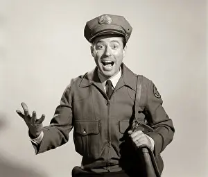 Mailman: Studio portrait of happy man mailman postman