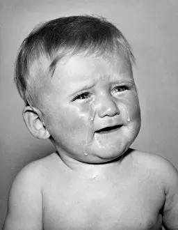 Cheeks: Studio portrait, little boy crying