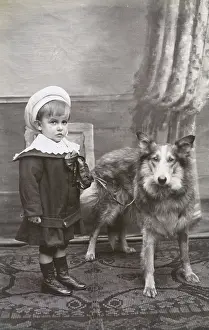 Collars: Studio portrait, little boy with a dog