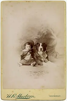 Backdrop: Studio portrait, little boy with large dog
