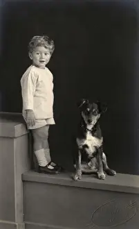Paignton: Studio portrait, little boy with puppy