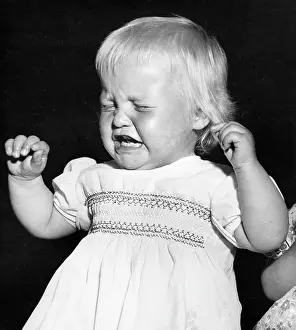 Smocked: Studio portrait, little child crying