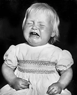 Smocked: Studio portrait, little child crying