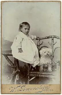 Toddlers: Studio portrait, little child with dog
