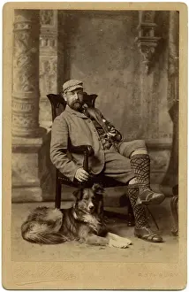 Tartan: Studio portrait, man with his dog