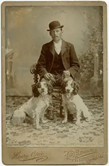 Backdrop: Studio portrait, man with his dogs