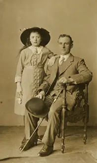 Pinstriped: Studio portrait, man and girl