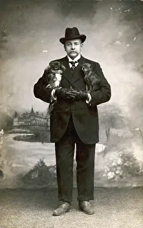 Pekes: Studio portrait, man with Pekingese dogs