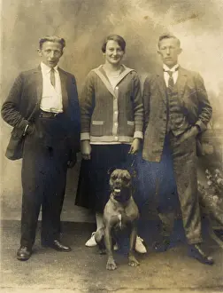 Pleated: Studio portrait, three people with boxer dog