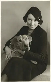 Walkers: Studio portrait, woman with dog