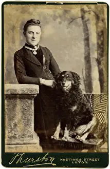 Backdrop: Studio portrait, woman with dog