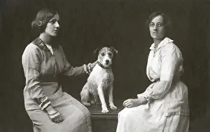 Cuffs: Studio portrait, two women with dog