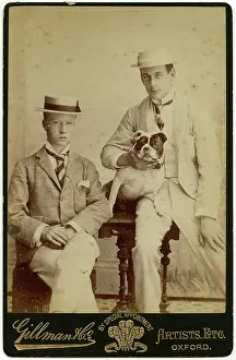 Boater: Studio portrait, two young men with bulldog