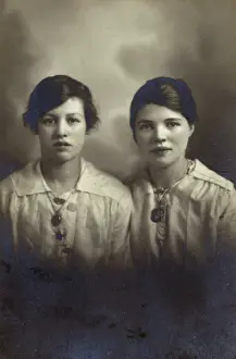 Blouses: Studio portrait, two young women in white blouses