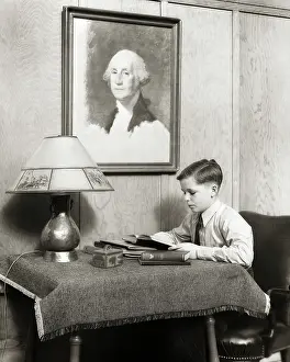Studious: Studious Boy Doing Homework Sitting Reading at