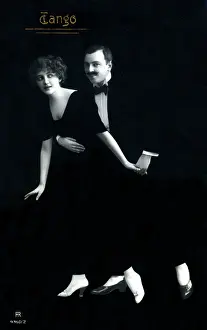 Tangoing: A stylish finely-dressed German couple dancing the Tango