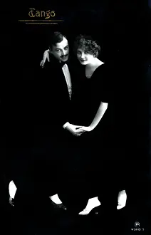 Tangoing: A stylish finely-dressed German couple dancing the Tango