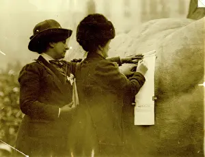 Harry Price: Two suffragettes signing a petition