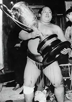 Sumo: A sumo wrestler with a trophy. Tokyo