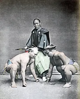 Sumo: Sumo wrestlers and referee, Japan, 1870s
