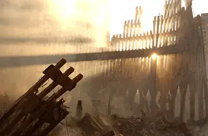 No One: Sun streams through the dust over the wreckage of