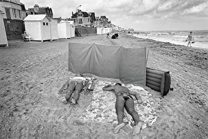 Sunbathers: Sunbathers on the beach at Langrune Sur Mar, Normandy