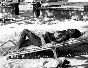 Bronzed: SUNBATHING ON LOUNGER