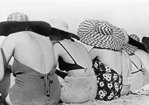 Sunbathing women with hats