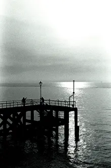 Gleam: Sunset over a pier