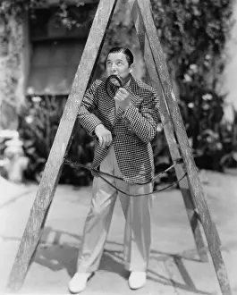 Absurd: Superstitious man walking under ladder