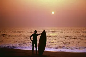Surfer: Surfer silhouetted against the sea