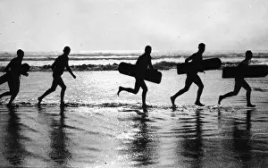 Surfing: Surfers on the way to the water