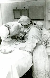 Graft: Surgeon preparing new skin in graft surgery