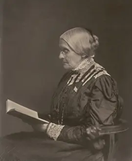 70 80 Years Old: Susan B. Anthony sitting and reading a book, ca
