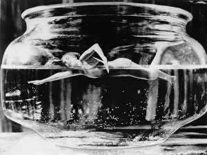 Photomontage: Swimmer in goldfish bowl