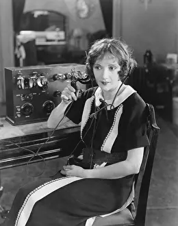 Employ: Switchboard operator sitting at telephone switchboard