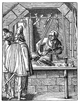 Item: The Sword Maker. Craftsman at his workbench holds